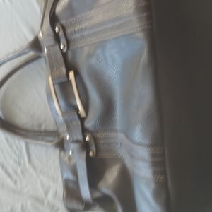 Black, man made purse with inside separate sections n zippered pocket